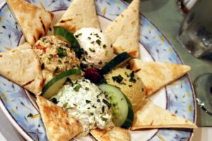 plate of pita bread with spreads