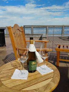 bottle of wine near the ocean